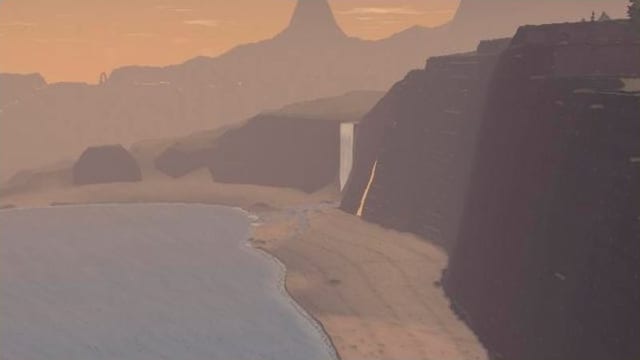 A lake shore and river delta below cliffs in warm evening light