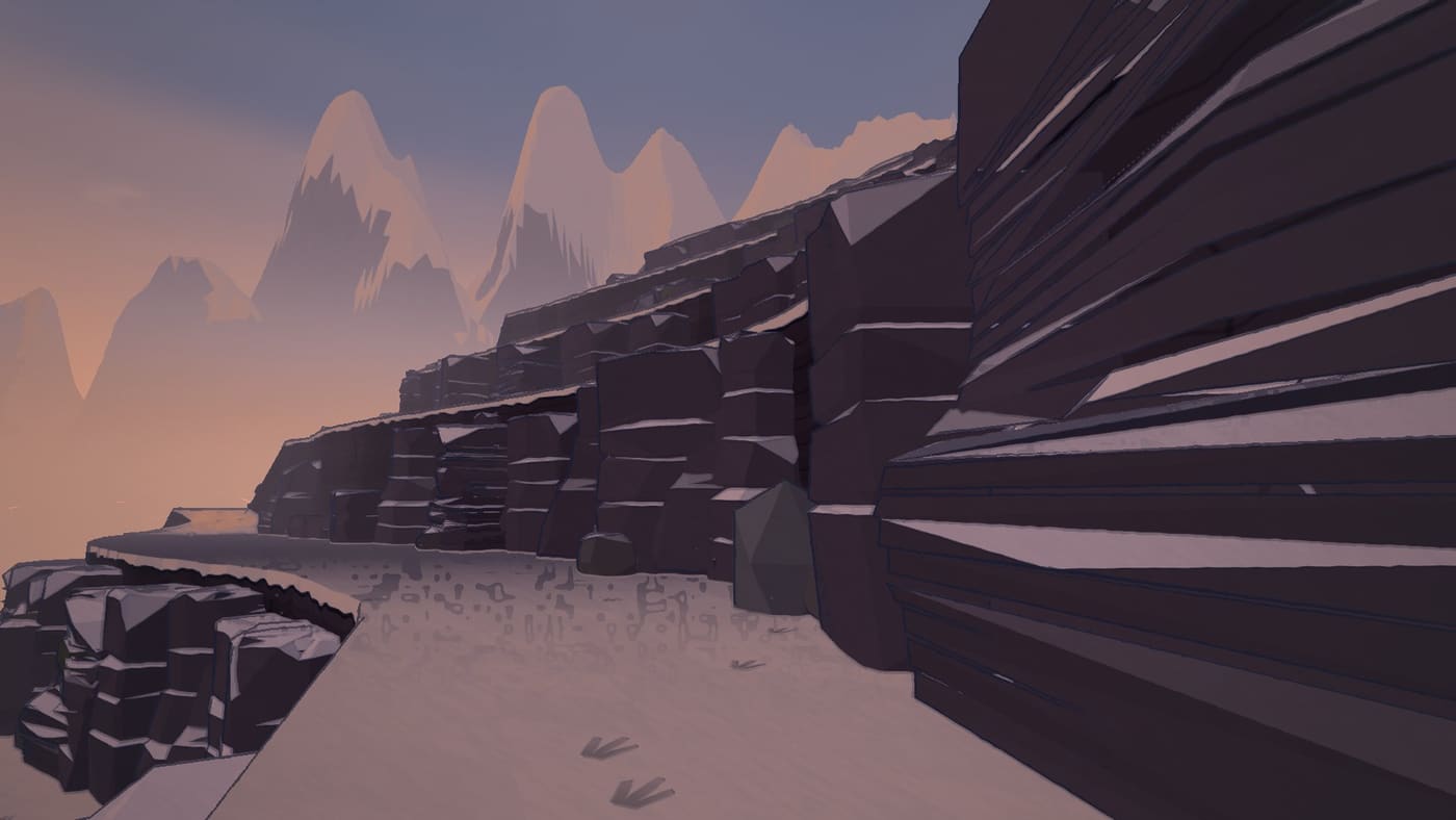 A snowy ledge below glowing peaks at first light
